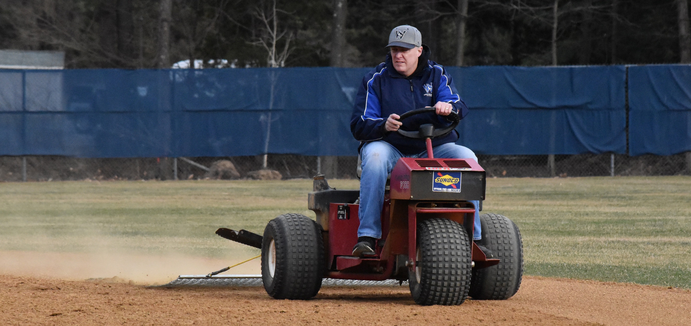 Jim Cloutier grooms the infield at Westfield State