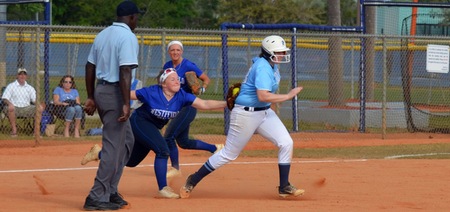 Jordyn Carpenter tags out a Gordon College runner in a rundown between second and third base.