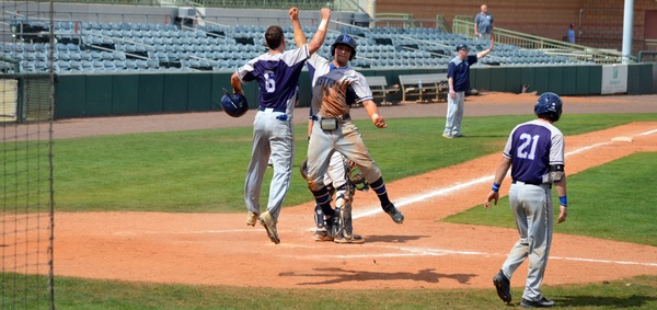 Casey Boudreau and Nick Martin celebrate after scoring on Colin Dunn's double in the third inning.