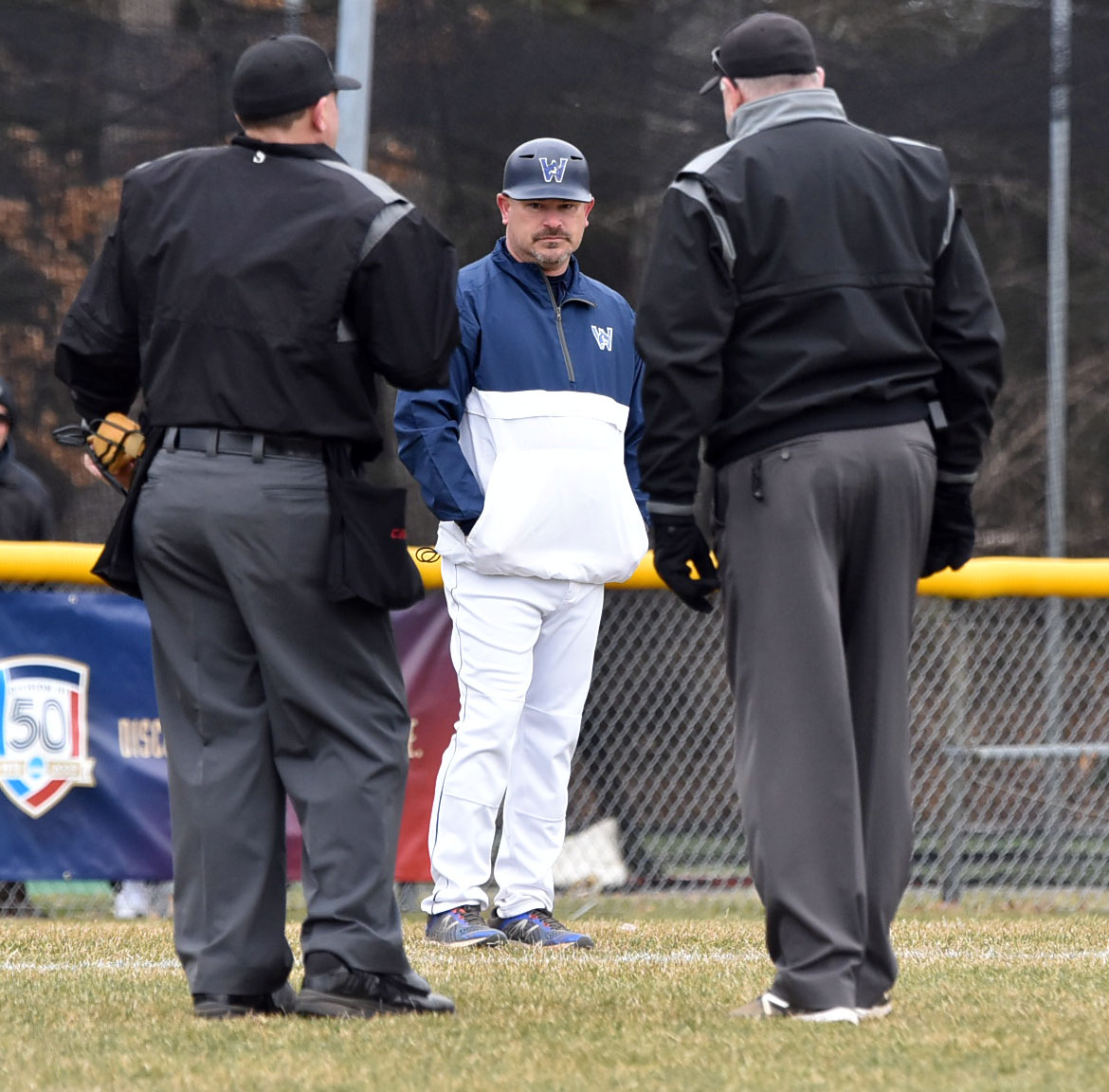 Westfield State baseball coach Seth Kaplan waits for a ruling from the umpires.