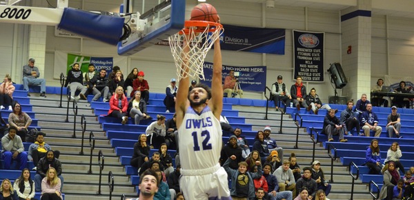 Marcus Collins dunks in the Owls 104-63 win over Lesley University. (Leo Clinton, Jr. photo)