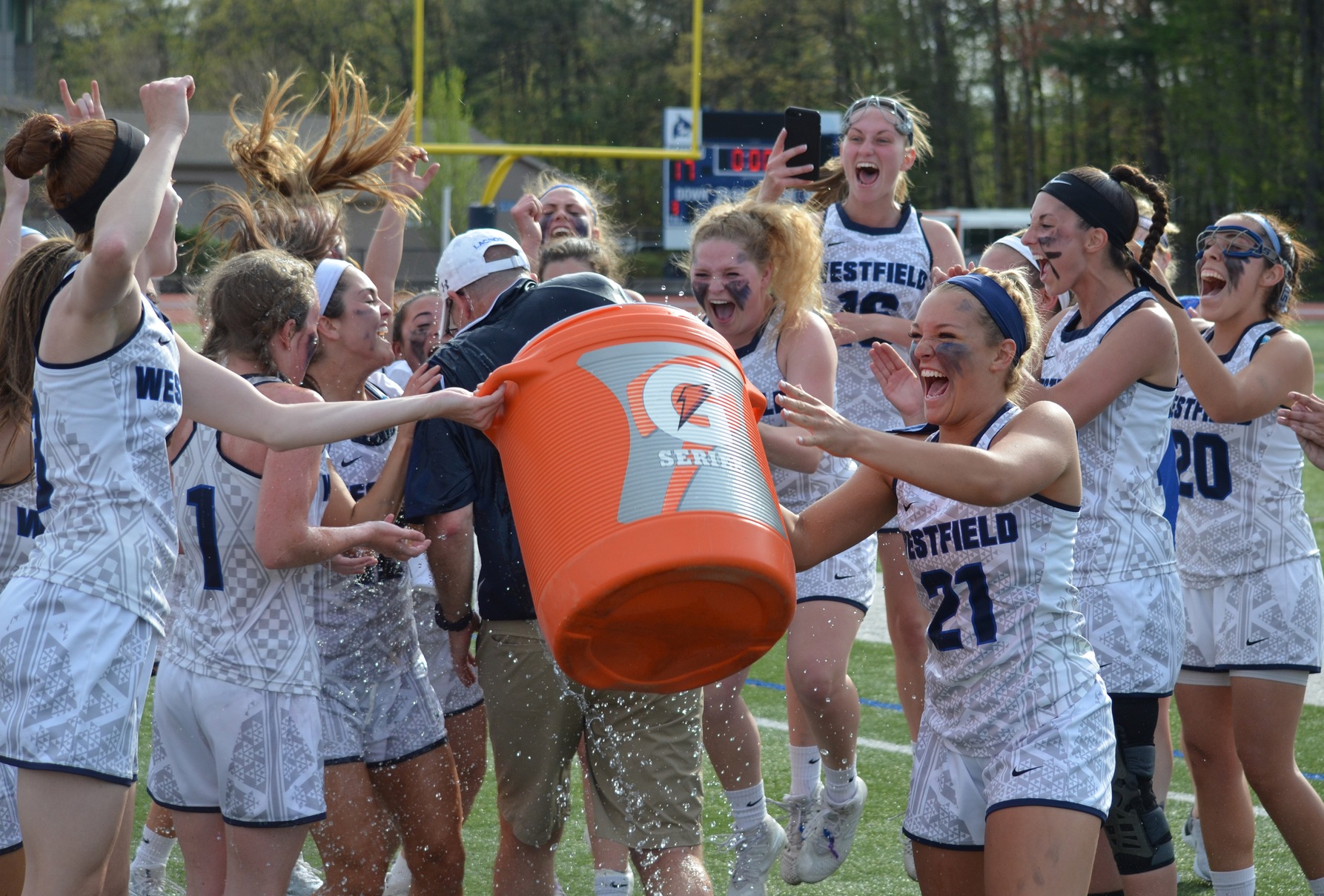 Westfield State coach Jeff Pechulis gets the Gatorade shower from his team after the 2018 MASCAC Championship game.